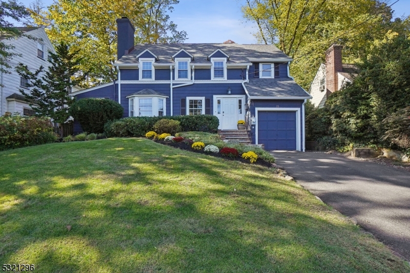Nestled in the heart of Short Hills, NJ, this exceptional 4-bedroom, 3 full & 2 half-bath colonial home effortlessly blends timeless elegance with modern luxury. Located in one of New Jersey's most prestigious neighborhoods with top-rated schools, and steps away from NJ Transit, offering both suburban tranquility and easy NYC access. Beautiful hardwood floors and recessed lighting add warmth and sophistication throughout. The main floor's bay windows flood the space with natural light. At the heart of the home lies a newly remodeled kitchen with a grand center island, premium stainless steel appliances, and sleek cabinetry. Overlooking a stunning backyard, the kitchen seamlessly connects indoor and outdoor spaces, ideal for both gatherings or quieter moments. Upstairs,4 large bedrooms and 3 full baths provide a serene retreat. The primary suite is a luxurious haven, the second en-suite, and the additional rooms offer ample space and flexibility. The finished walkout basement, with tile flooring, accessed by new hardwood stairs, offers versatile space for a home theater, gym, or den. Outside, a two-tiered backyard with lush landscaping, mature trees, and planting beds creates a private oasis, perfect for gatherings, gardening, or relaxation. Recent upgrades include a 50-year warranty roof, new gutters, a steam boiler, and a fully renovated kitchen. This freshly painted, move-in-ready home combines luxury, functionality, and thoughtful design, offering a sophisticated sanctuary