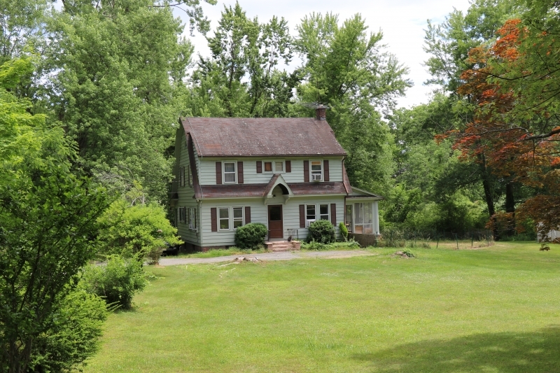 Welcome home to your CHARMING Country setting, located in Boonton Twp with Low Taxes! This house is set on a (.79 acre) with serenity.  Step into the parlor area, filled with original woodwork. There is a formal dining room  perfect for entertaining! The Living room, has a brick  fireplace and wood mantle. Spend your summer nights outside in your screened-in porch!  The Eat-in Kitchen has high cabinets and leads to a mud room, back porch and basement area.  Going up to the second floor you have 3 bedrooms and bath. There are hardwood floors under all carpeting except in the kitchen, bathroom, and mudroom. Walk down to the basement, with  a laundry room and utility area. All this and minutes away from town, shopping and more! Truly time to be willing to put in those skills to make it your own.