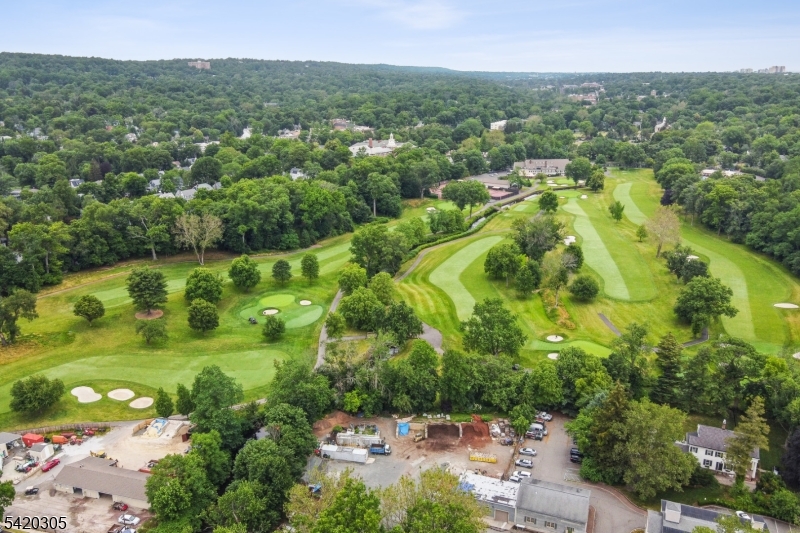 This is a truly rare development opportunity set on approximately 1.47 acres in a highly desirable and picturesque location. The property is uniquely positioned with sweeping views overlooking the beautiful Maplewood Country Club golf course, offering a serene, park-like setting that is increasingly difficult to find in today's market. Ideally situated just moments from the vibrant Maplewood Village, the property is currently classified as a grandfathered, non-conforming commercial use, while being located within a residential zoning district. This presents a distinctive opportunity for investors, developers, or end users to explore a variety of potential redevelopment scenarios, subject to municipal approvals. Whether envisioning a custom residential project or seeking to capitalize on its unique zoning status, this site offers exceptional flexibility and long-term value in one of the area's most sought-after locations.