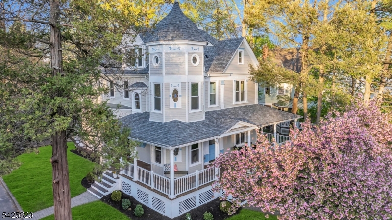 Nestled in the heart of Westfield, just moments from downtown, Mindowaskin Park, and top-rated schools, this renovated and expanded Victorian home beautifully blends timeless character with modern living. A restored front porch welcomes you into a grand foyer, where stunning stained-glass windows, beautiful woodwork, and brand-new flooring throughout set the tone for what is to come. Light-filled living spaces include an inviting family room with a wood-burning fireplace, creating a warm and welcoming setting for everyday living and entertaining.The heart of the home is a beautifully designed kitchen with Thermador appliances, quartz countertops, an impressive 11-foot waterfall island, custom soft-close cabinetry, a walk-in pantry, and a coffee bar w/ wine fridge.The second floor offers a luxurious primary suite with a custom closet, private balcony, and enormous spa-like bath, along with three additional bedrooms, a hall bath, and an ensuite bath. A sun-filled turret provides a charming space for a home office, reading nook, or retreat. The third floor features two additional bedrooms connected by a Jack-and-Jill bath. The finished basement offers flexible living space with a full bath. With HardiePlank siding, new electrical and plumbing, and a fully fenced backyard, just to name a few updates. Dont miss this rare opportunity to own a truly special home in one of Westfield's most sought-after locations, where history, beauty, and everyday comfort come together with ease.