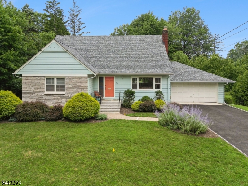 Just minutes from the NYC train & the charming hubs of Upper Montclair & Little Falls, this turnkey home sits on one of Little Falls' most coveted streets. Sunlight pours through picture windows highlighting the spacious living room w/ frplc, formal seating area, & separate lounge space, perfect for relaxing or watching TV. The newly renovated kitchen shines w/ Bosch appliances, custom cabinetry, & farm sink. Flowing seamlessly into the dining room, w/ sweeping views of the expansive property, this inviting space is ideal for formal meals or a cup of coffee & your laptop. A secluded, breezy sunroom is an idyllic retreat for reading or an afternoon nap. First-floor laundry w/ half bath offers backyard access, while a flexible bedroom with adjacent full bath is ideal for guests, home office, or one-floor living. Upstairs, you'll find a large second bedroom with two deep closets, a gracious primary w/ walk-in closet & sitting area, plus a second full bath and attic storage.  The lower level, with full size windows and access to the 2-car garage, features a TV area, billiards/ping-pong zone, home gym & bar!  Add'l highlights incl a new roof, newly paved drive, freshly painted exterior, hrdwd flrs, & car charger. Featured by The NYT as a low-key historic suburb, Little Falls offers a vibrant Main Street w/ shops, restaurants, cafes & fitness studios, plus parks, nature trails, highly rated schools & lower taxes than many neighboring towns. This lovely peaceful home is a must see!
