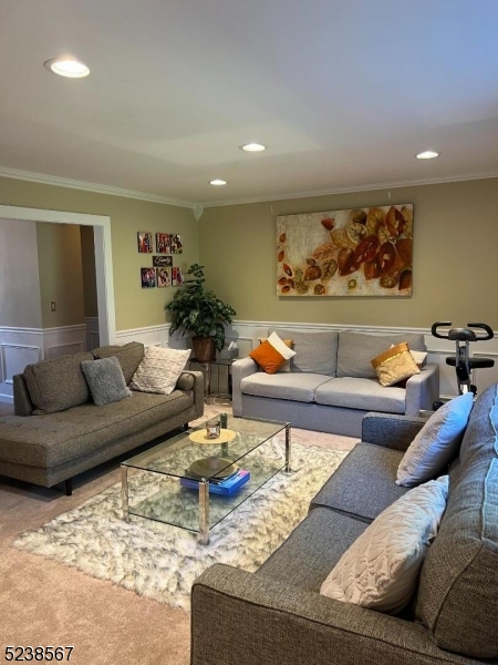 Move right into this two bedroom, one bath condo located at sought after Mountain Club in Parsippany with assigned parking. This end unit boasts many upgrades. Garage space is available for additional $50/month. Beautifully renovated kitchen with SS appliances, granite countertops & crown molding & recessed lighting, large living room, wall a/c in living room and bedrooms, and updated bathroom makes this home perfect. Laundry and storage in basement. Community offers a clubhouse, gym, tennis court and pool! Minutes from train station and highways. Parking spot is #200 which is the closest parking spot.  Rental includes water, heat, sewer and garbage. Electricity and Internet are additional.