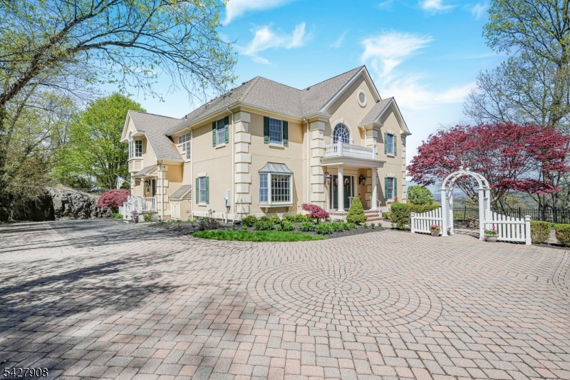 Over 5000 sq ft w/ breathtaking views & total privacy inside a gorgeous gated swim/tennis community! This elegantly appointed 5 Bedroom, 3.5 bath Custom Colonial is the perfect blend of luxury & comfort! From the grand 2 story foyer to the stunning mountain & sunset views, no detail was overlooked! Spacious eat in kitchen w/ center island, walk in pantry, breakfast bar, & breakfast room w/ wall of windows! Grand family Room space w/ 2 story stone fireplace, soaring coffered ceiling, built in cabs, & gorgeous oversize window. The formal dining room is a great space for entertaining w/ a tray ceiling, window seat, & adjacent butler's pantry w/ wet bar. 1st floor office has French doors, custom millwork, & built ins. A formal living room, sunroom, & powder room are also located on this level. Upstairs the Primary Suite offers a sitting room w/ gas fireplace, balcony overlooking the mountains, 2 walk in closets, & fabulous en suite bath w/ jetted tub, stall shower, bidet, & dual vanity. 4 additional BRs plus 2 baths completed this level. The finished walk up attic offers more storage & access to a ONE OF A KIND rooftop deck overlooking the mountains & surrounding farmland w/ spectacular evening sunsets! Additional features include: 1st floor laundry/mud room, fin basement rec room, 2 garage doors w/ space to park 3-4 cars using the tandem space, Enjoy Panther Valley's 3 outdoor pools, tennis/sport courts, playgrounds, scenic walking paths, & optional golf access.