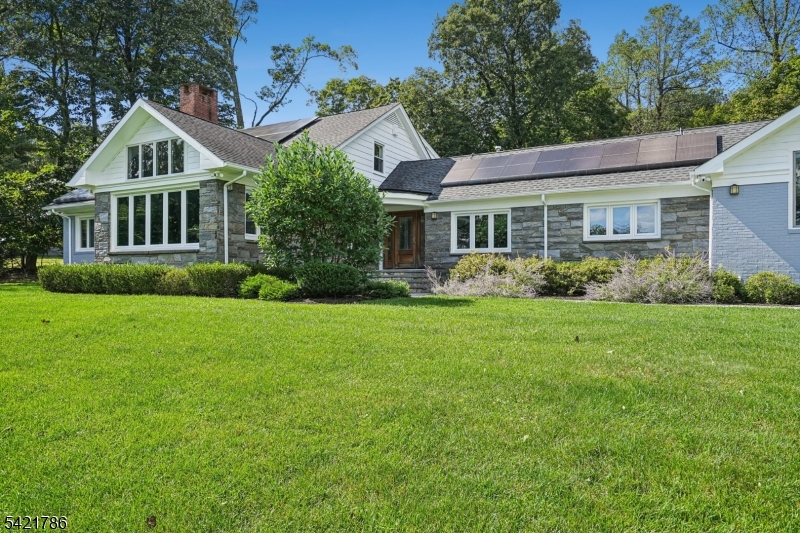 Absolutely stunning, this fully renovated 6-bedroom, 5 full and 2 half bath raised ranch is perched on a hilltop and drenched in natural light, offering tranquility, relaxation, and a seamless connection to nature where everyday living feels like a vacation. The open layout connects expansive living spaces including outdoors, ideal for today's work-from-home lifestyle, This smart home features two solar rooftop systems, all new double-pane windows, and energy-conscious upgrades. The outdoor oasis is unmatched, with a heated in-ground pool, fully equipped pool house with kitchen and full bath, and bluestone patios perfect for dining, lounging, and outdoor movie nights.The formal yet inviting living room showcases dramatic architectural detail, a wall of windows capturing sunrise and NYC skyline sunset views Plans are available for the 3,100 SF basement, where walls, French drains, and five sump pumps are already in place. At the heart of the home is the chef's kitchen and family room, featuring custom Spanish cabinetry, high-end appliances, and a 15' x 6' island with prep sink, wine cooler, and seating for six, plus a separate dining area. A 1st fl laundry rm off the mudroom  3 distinct sleeping/work zones provide flexibility: A 1st fl primary suite w/ fireplace, dressing room, walk-in closet, &  bath, plus a 1st fl bedroom w/bath a 2nd-fl south wing - 3 bedrooms and hall bath; a private north wing studio bedroom with its own staircase,  bath, and sink. A garage w/ EV charger.
