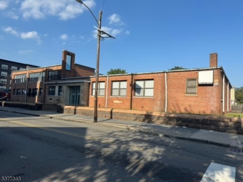 Excellent property in good shape - formerly used as a YWCA, a recreation and learning center. This could be a great property for continued use, and it may also have development possibilities. Property is available immediately. Inside the space are lunch and study areas, a gym, offices, and classrooms. Additionally, there is ample space for parking, a playground, and more. Downstairs, there is a locker room. This building has lots of amenities.