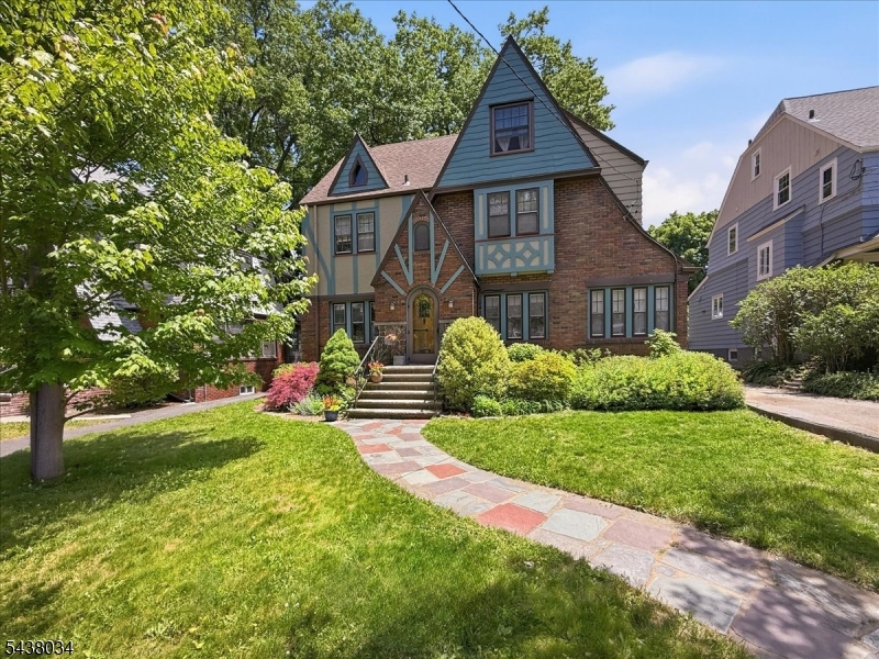 Welcome to this distinguished Tudor Colonial located on a picturesque, tree-lined street in one of Maplewood's most desirable neighborhoods. Rich in traditional charm and timeless character, this spacious residence offers 12 total rooms, including 6 bedrooms and 3.5 bathrooms, with over 2,700 square feet of living space. Original architectural details, beautiful hardwood floors, and thoughtfully preserved craftsmanship blend seamlessly with modern conveniences, creating a home that is both elegant and inviting.The home's generous layout provides exceptional flexibility for today's lifestyle, featuring expansive living and dining spaces, a well-appointed kitchen with stainless steel appliances, and a spacious primary suite complete with a private bathroom. Whether hosting gatherings or enjoying everyday living, the home's abundance of natural light, classic design elements, and functional floor plan offer comfort and sophistication throughout. Set on an 8,712-square-foot lot, the property also includes a patio for outdoor entertaining, a storage shed, a detached two-car garage, and a blacktop driveway.Ideally situated just moments from Maplewood Village, residents enjoy easy access to boutique shopping, acclaimed restaurants, caf s, community events, and Midtown Direct train service to New York City. Outdoor enthusiasts will appreciate nearby Memorial Park and South Mountain Reservation, while members can take advantage of the prestigious Maplewood Country Club.
