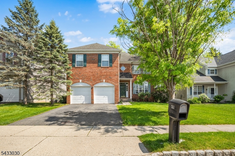 Claim your spot as one of the lucky few owners of this spectacular elevated brick facade colonial offering peaceful glimpses of the river below! You will experience incredible scenic tranquility and supreme privacy. A grand bright foyer and staircase welcomes you inside. Prepare to be amazed by the stunning two story grand family room that houses a beautiful fireplace and overlooks the kitchen. The open formal living area and separate light drenched dining space provide the perfect setting for entertaining. Your well maintained kitchen invites you to enjoy great counter space on the peninsula and free standing island. Enjoy your meals overlooking a private backyard retreat in the bumped out breakfast nook. A convenient powder room and dedicated laundry room along with direct access to a spacious two car garage finish the main level. Head upstairs to find a spacious primary suite acting as your ultimate private retreat. Double doors open to reveal hardwood floors and a cozy sitting area plus a massive walk in closet. Unwind in the spa like private bath equipped with a jetted soaking tub and dual sink vanity and a standing shower. Three more generously sized bedrooms with beautiful hardwood (2025)  and a full bathroom round out the upper level. Downstairs the fully finished basement features newer carpet and expands your usable living space. Close to Main St and local schools and highways 46 and 80 this magnificent freshly painted move in ready home is a truly spectacular find!