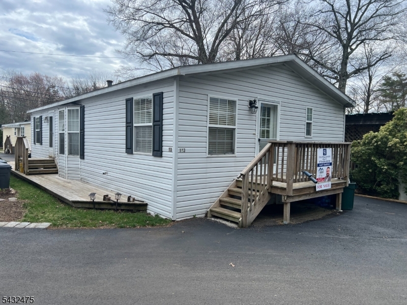 This newer double wide mobile home offers THREE BEDROOMS & TWO FULL BATHS, updated eat in kitchen with stainless steel appliances, granite countertops, newer washer and dryer off kitchen. Step into the dining/living room area with cathedral ceilings and floor to ceiling window. Throughout this unit you will be amazed by all the skylights that bring in all the natural light you deserve. Newer floors throughout the entire home makes it move in ready for you. The main bathroom has been completely updated and is a pleasure to see. The Primary bedroom offers double closets and a bathroom with a custom shower with sitting area that is a must see. One floor living at its best! More upgrades include newer windows, shed in the rear of the home and so much more. This community offers lake access on the property, walking path, and is just a friendly neighborhood to live in. Perfect for that first time home buyer or someone down sizing and needs one floor living at a very affordable price. Make your appointment today!