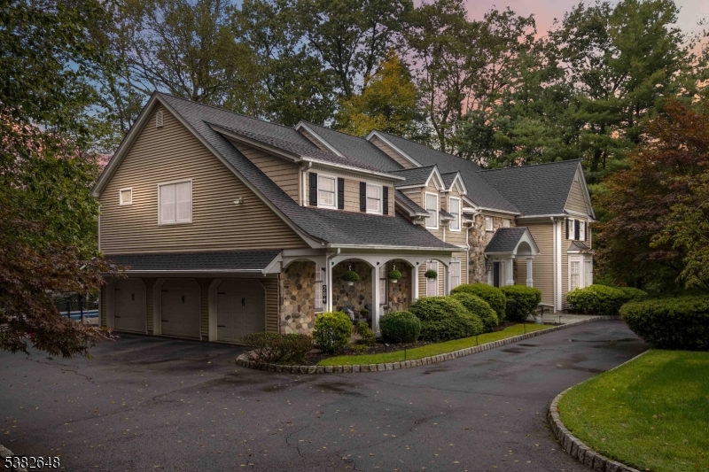 Country Charm Meets Modern Elegance -Stunning Ctr Hall Colonial w/timeless stone & beige siding feels like a decorator's showhouse blending refined updates w/modern comfort. Enter the grand 2-story foyer w/drop-down chandelier & notice the details ncluding gleaming hardward floors and stylish powder room,  Chef's KIT boasts quartz island, granite counters, Viking 6-burner stove, Sub-Zero, pot filler, MW drawer, custom cabs w/spice racks & filtered sink water. Sunlit dining area opens to deck for indoor/outdoor living. Formal DR w/wainscoting & chandelier, soaring 2-story FR w/Palladian windows & stone FP, plus library/office w/built-ins & bar. 1st-fl BR w/outdoor access ideal for guests. Upstairs, the Primary Suite offers FP, 2 cedar closets & spa-like BA w/Porcelanosa marble & chrome finishes. Add'l BRs feature spacious closets, updated BAs & Restoration Hardware touches throughout.Fabulous walk-out BSMT incl wet bar w/quartz island & bev center, media area, gym w/mirrored wall & barn door, office, storage & stylish Porcelanosa BA.Outdoors: heated pool w/jetted sitting area, b-ball area, pergola-covered deck & landscaped grounds w/sprinklers.Extras: 3-car gar, multi-zone A/C, 7-zone heat, newer roof (4 yrs), HWH (6 yrs), septic serviced, generator hook-up, alarm, Ring cameras & central vac.This is Franklin Lakes living at its best luxury, comfort & timeless style!