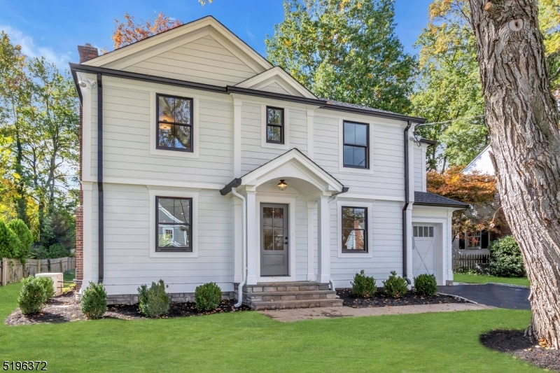 Fall in love with this deceivingly large Colonial located on an established neighborhood in the Lafayette section of Chatham. Walk to EVERYTHING! Local premier builder with years of experience.Thoughtfully designed floor plan with living room, dining room, eat-in kitchen, family room, mud room and 1/2 bath on the first floor. Perfect for entertaining! Fireplaces located in the family room and living room. Kitchen is equipped with Thermador stainless steel appliances, quartz counters, white shaker cabinets & a large island with additional storage. Generous island seating for four. Gorgeous white oak floors throughout in neutral stain that will compliment any decor. The 2nd level consists of 4 spacious bedrooms, 3 full baths, laundry room with sink and ample closets. The primary bedroom oasis is located in the back of the home overlooking the yard. Stunning primary bath w/large neutral tile, double sinks, oversized shower and private toilet room. The finished lower level has luxury vinyl floors, a bedroom with a full bath and a generously sized recreation room that can be used as a gym, theatre or playroom. Additional features:Hardie siding, Anderson 400 windows, full house generator, large patio w/a gas grill hookup along with sod and underground sprinklers complete the outside. All room sizes are approximate.