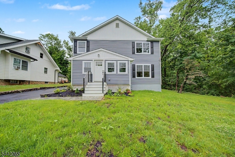 Welcome to this spectacular, fully rebuilt and reimagined 4-bedroom, 3-bath home in a neighborhood setting within the sought after Randolph School District. Renovated with premium craftsmanship from the foundation up, this residence offers total peace of mind of a new home with brand-new siding, roof, electrical, plumbing, heat & central air systems, bathrooms and "chefs kitchen". Step inside to an airy, light-filled layout boasting high ceilings, gorgeous hardwood floors, and abundant natural light throughout. The heart of the home is the stunning designer kitchen, featuring sleek quartz countertops, a massive center island perfect for entertaining, and seamless flow into the living spaces anchored by a cozy gas fireplace. The highly desirable floor plan includes a convenient first-floor bedroom with direct access to a full bathroom ideal for guests or a home office. Upstairs, you will find three additional spacious bedrooms, two beautifully appointed full baths and a oversized laundry room for extra storage opportunity. The expansive, unfinished basement features "bilco" doors for easy outdoor access and offers potential for additional space or lots of storage. This beautiful home is situated on a private level spacious lot. Complete with public utilities and an unbeatable location close to local parks, multiple highways, shopping, and top-tier schools, this turn-key masterpiece is ready for its very first owners.