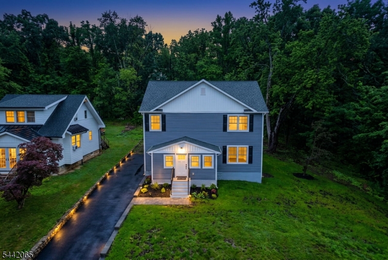 Welcome to this spectacular, fully rebuilt and reimagined 4-bedroom, 3-bath home in a neighborhood setting within the sought after Randolph School District. Renovated with premium craftsmanship from the foundation up, this residence offers total peace of mind of a new home with brand-new siding, roof, electrical, plumbing, heat & central air systems, bathrooms and "chefs kitchen". Step inside to an airy, light-filled layout boasting high ceilings, gorgeous hardwood floors, and abundant natural light throughout. The heart of the home is the stunning designer kitchen, featuring sleek quartz countertops, a massive center island perfect for entertaining, and seamless flow into the living spaces anchored by a cozy gas fireplace. The highly desirable floor plan includes a convenient first-floor bedroom with direct access to a full bathroom ideal for guests or a home office. Upstairs, you will find three additional spacious bedrooms, two beautifully appointed full baths and a oversized laundry room for extra storage opportunity. The expansive, unfinished basement features "bilco" doors for easy outdoor access and offers potential for additional space or lots of storage. This beautiful home is situated on a private level spacious lot. Complete with public utilities and an unbeatable location close to local parks, multiple highways, shopping, and top-tier schools, this turn-key masterpiece is ready for its very first owners.