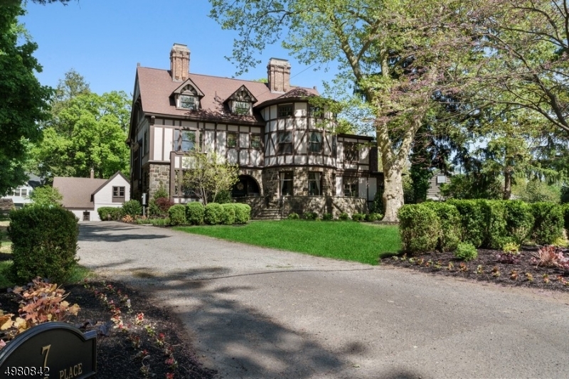 Magnificent Tudor Estate. The Grandeur of Yesteryear and the Modern Amenities of Today. "The Fortress" designated Hartshorn House #50, one of Short Hill's most prominent areas, level grounds, .94 acre Grand Foyer, high ceilings, front to back Family Rm, Beautiful Kitchen, center island, breakfast area, French doors leading to slate patio, Butler's Pantry adjacent to Formal Dining Rm, Formal LR, Homework Rm + Office. Master BR suite, spa like bath & dressing rm + A junior suite & two more BR's on second floor. Full 3rd floor w/3 BR's, hall bath, walk-in cedar closet.  Walk out LL: Rec Rm, Wet bar, Home Theater, Gym, full bath, future wine cellar possibility, Storage. Two story 2-Car Garage, with walk up. Perfectly located close to town, .5 mi to Train & Glenwood School...Suburban living at it's Finest
