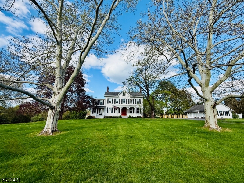 BRAND NEW SEPTIC REPLACEMENT (TOWN VERIFIED 5+ BEDROOMS) as well as BRAND NEW WELL PUMP Situated on a Picturesque 3.52 Acre Lot, this "One-of-a-Kind" Vintage Home Boasts High Ceilings with an Expansive Custom Kitchen which is Open to a Large Family Room with a Striking Stone Fireplace and Priceless Private Views of the Backyard. The Kitchen Pairs Rustic Stone Flooring, Granite Countertops and Antiqued Cabinetry with a 6 Burner Viking Stove and a Built-In Wine Refrigerator in the Center Island. Just off the Family Room and Kitchen are Exits Leading to an Expansive Deck with Privacy and Serenity! The Interior Displays Pumpkin Pine and Oak Floors with the Exception of the Kitchen, Family Room and Baths. The Bright Interior Still Displays the Original Intricate Fireplace Mantles and Period Fixtures. The Primary Bedroom is Also Expansive with a Separate Sitting Room or Office, Two Large Closets Lead to a Primary Bath with a Spa Tub, Separate Large Shower and Double Vanity. The First Level Also has an In-Law Wing with its Own Entry, a Full Bath and Separate Laundry Area!!!  2 More Charming Full Baths Serve 3 More Bedrooms and a "Multi-Use Room". Preservation was Extremely Important During a 2002 RENOVATION and EXPANSION Making This Home Truly Unique! This Gorgeous Home has an AWARD-WINNING School District with the Bus Stop at the end of the driveway! This 5 Bedroom 4.5 Bath Home Sits up high across the Street from a Park and Arboretum with a Playground and Beautiful Walking Trails!