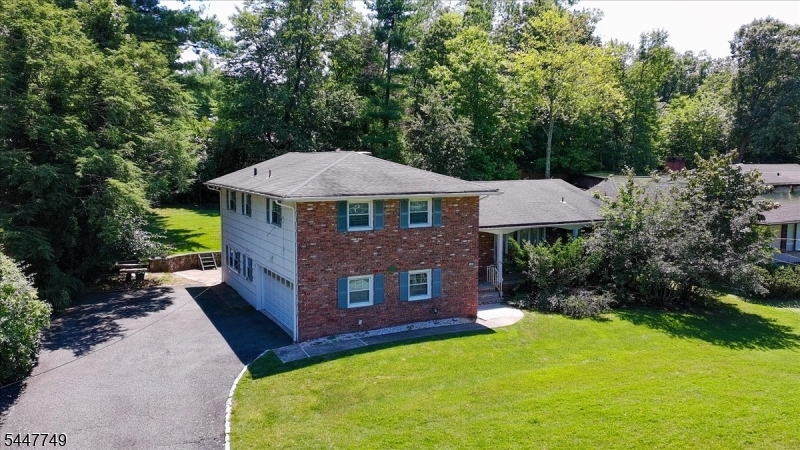 This spacious 4 bedroom, 3 full bath split-level home is situated on a beautiful, quiet street in the sought-after St. Cloud section. Interior features high natural light living room with a bay window, a formal dining room, and hardwood flooring throughout main living areas. Eat-in kitchen has granite countertops, abundant wood cabinetry, stainless-steel appliances, and recessed lighting. Versatile ground-level family room features brick fireplace, tiled flooring, and direct access to backyard. Finished basement provides additional living space . Highlights include central air with multiple zones, three full baths, and attached two-car garage. Backyard is spacious and treelined, providing privacy and plenty of room for recreation and outdoor gatherings. Ideally located near St. Cloud Elementary School, the golf course, recreation facilities, Turtle Back Zoo, NYC transportation, and major highways.