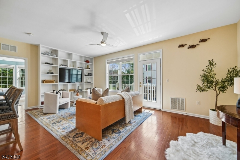 Beautiful Begonia model filled with sunshine and bright, open living spaces! The refreshed kitchen features a new electric stove and cooktop, elegant backsplash, updated hardware, bright new countertops, and cabinetry finished all the way to the ceiling no open gaps for a clean, custom look.The spacious primary suite offers an enormous closet and serene views of the park and trees in bloom. Enjoy your morning coffee on the private terrace overlooking adjacent walking paths and lush greenery.Additional highlights include a private in-unit laundry room, attached first-floor private garage access, and a large storage space.The Four Seasons 55+ lifestyle amenities are truly unmatched: craft/card room, billiards room, ballroom, fitness center, indoor pool, terrace room, outdoor pool, bocce courts, tennis courts, and pickleball all set against stunning views of the NYC skyline.