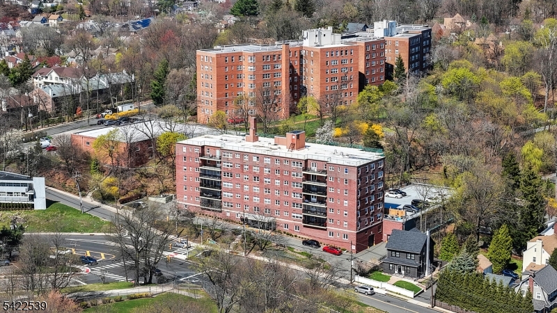 Beautifully maintained condo in the heart of Montclair, just moments from downtown and just over 1 mile to the train. Inside, wood floors flow seamlessly throughout, leading to an oversized living room with plenty of space to relax or entertain. A defined dining area connects easily to the upgraded kitchen, featuring stone countertops, rich cherry cabinetry, stainless steel appliances, and exceptional storage. Both bedrooms are generously sized with ample closet space throughout. Additional highlights include a heated garage with assigned parking space, elevator building convenience, and a bus stop right across the street for easy commuting. Monthly maintenance includes heat, water, and sewer. Pet-friendly complex with additional storage and laundry located in the basement. All just minutes to shops, restaurants, and NYC transportation.