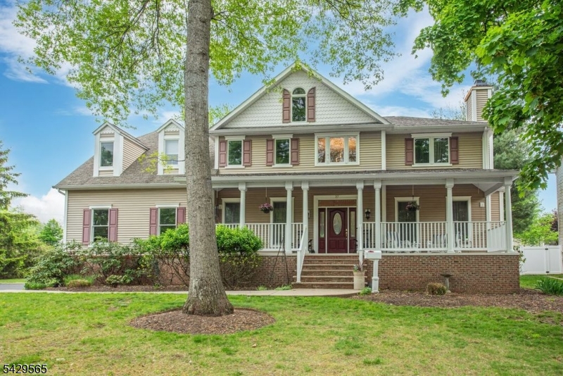HIGHEST & BEST OFFERS DUE SATURDAY 4:00 Welcome to this custom Colonial featuring a charming front porch and impressive 2 story entry foyer. The first floor offers beautiful hardwood floors, a formal living room with a gas fireplace, a large formal dining room, and a spacious, sun-filled family room with a wood-burning fireplace and sliders leading to the deck. This level also includes a first-floor bedroom, full bath, laundry room, and an expansive open-concept kitchen with a center island with seating, stainless steel appliances, and a bright breakfast room with ample space for everyday dining.The second level features 4/5 bedrooms, including an ensuite bedroom, a hall bath, and a generously sized primary suite complete with a large spa-like bath offering a walk-in shower, jetted tub, dual vanities and walk-in closet.The oversized walk-out basement has already been framed for multiple rooms, including a bathroom, and is ready to be finished to suit your needs. Conveniently located near restaurants, schools, transportation, and major highways, this home offers space, comfort, and endless potential.