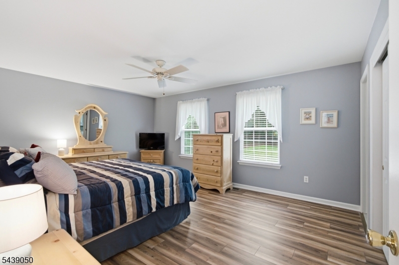 Whether starting out with a first home or downsizing after several, you will be pleased with the features and amenities not found in many available for this price. One owner and Schneider & Bennett Development Co. built, this well-maintained home is move-in ready. Enjoy the country front porch for morning coffee and the rear private deck/patio for quiet afternoon naps and happy hour cocktails. Step inside to find generous size rooms with laminate/vinyl plank wood style flooring. Granite kitchen counters with stainless appliances and both formal and eat-in kitchen dining areas. Just off the kitchen is the convenience of laundry,1/2 bath and entrance with only a couple of steps down to the two-car attached garage for ease of carrying shopping bags & other bulky items right into the house. A propane gas fireplace in the living room currently fitted with an electric unit offers ambiance on cool nights and can easily be returned to the propane use. Enjoy well-proportioned bedrooms with plenty of closet space including two doubles in the primary. A full bath in the primary and the hall bath are also a good size. A whole house back-up generator, "optional" use of Lake Iliff, walking distance to one of the best Pubs/restaurants around and Kittatinny State Park just down the road completes the package.