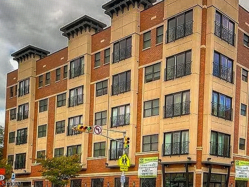 This condo name is Harmony Square. It's built in 2013 and is centrally located in the Mt. Pleasant section of Newark! Lovely modern/contemporary 1 bedroom, 1 bathroom condo is in a prime heart of the city location.  Beautiful hallways lead to this peaceful and modern unit. So much shopping with entertainment and transportation mins away from Newark Penn Station and Newark Airport. Open floor plan with generous living room and large windows to allow natural light. Contemporary kitchen w stainless steel appliances, granite countertops, and lots of cabinet space. Elevators, in-unit laundry facilities, an underground garage although this unit does NOT have a designated space, a secure entry system and 24-hour surveillance. With so much to do in Newark you won't want to miss this beauty.