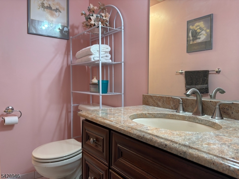 Pride of ownership Bi-Level which has many quality upgrades. Four Bedrooms, 3 full bathes all updated within the past 5 years. Kitchen has a generous size island with a built in microwave and newer appliances.  Deck off the top level with a gate and steps down to lower level.  Don't hesitate to bring your clients as this home is ready to occupy and we can offer to leave much of the furniture at a very low cost.  The lot is flat and grounds are manicured and treated yearly.  Close to major highways, shopping, schools and parks.  Home faces NE. Newer tankless water heater, newer roof, Security System and Fire System and ceiling fans throughout the home. This is a must see!  Water softener is owned solar panel cost $75 per month and no utility bill for electric.