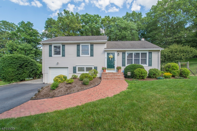 Bright, Lovely Split Level located in the desirable Country Wood section of Cedar Knolls. Meticulously Maintained. Shows pride of ownership. Lovingly cared for 38 years. Lots of Generous Room Size to Spread Out & Make Your Own! Beautiful HW Floors. Bright & Sunny living space. Eat-in Kitchen w/ Separate DR plus formal LR. 2nd Level boasts large mstr en-suite & 2 addtl bdrms & full bath. 4 bdrm on ground level along w/PR, garage access & walkout to backyard. Huge Family Room newly renovated walks out to large, leveled backyard. Enjoy the privacy on deck or while gardening. Unfinished bsmt is a huge BONUS providing plenty of storage in addition to 1 car garage. Twp has a pool, community center, etc. Easy access into DWTN Morristown, Morris Plains, NYC direct transportation & parks. Great community! Top schools!