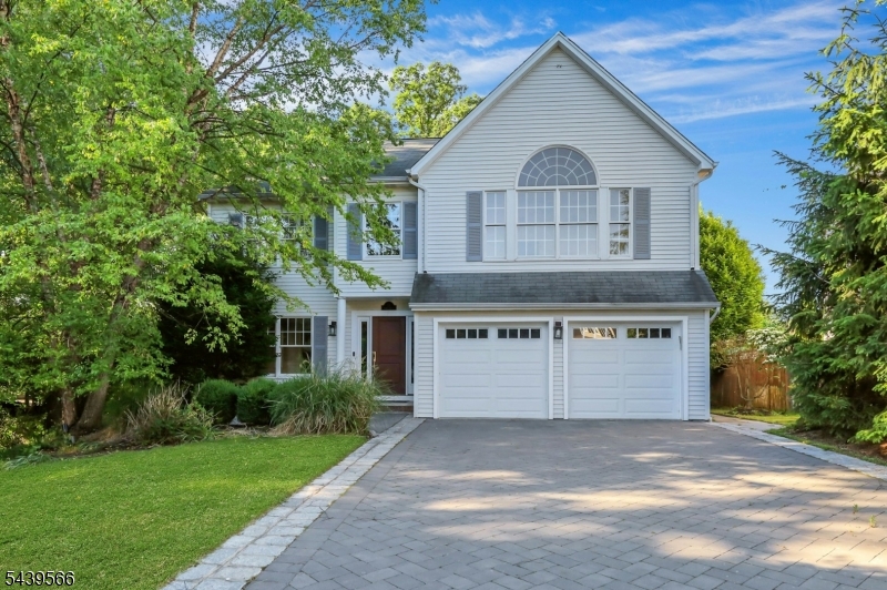Welcome to this stunning Colonial-style home offering the perfect blend of elegance, comfort, and modern living. Featuring 4 spacious bedrooms and 3 full bathrooms, this beautifully maintained residence boasts an open-concept floor plan filled with natural sunlight throughout. The inviting family room showcases a cozy gas fireplace and flows seamlessly into the main living and entertaining areas. The luxurious primary suite features a soaring cathedral ceiling, a private full bath, and two walk-in closets. The finished basement provides exceptional additional living space, complete with a wet bar, 5th bedroom, and full bath ideal for guests,  recreation, or a home office. Bright, spacious, and thoughtfully designed, this exceptional home offers the perfect setting for both everyday living and entertaining. Conveniently located in desirable Montvale, close to shopping, dining, parks, and transportation.