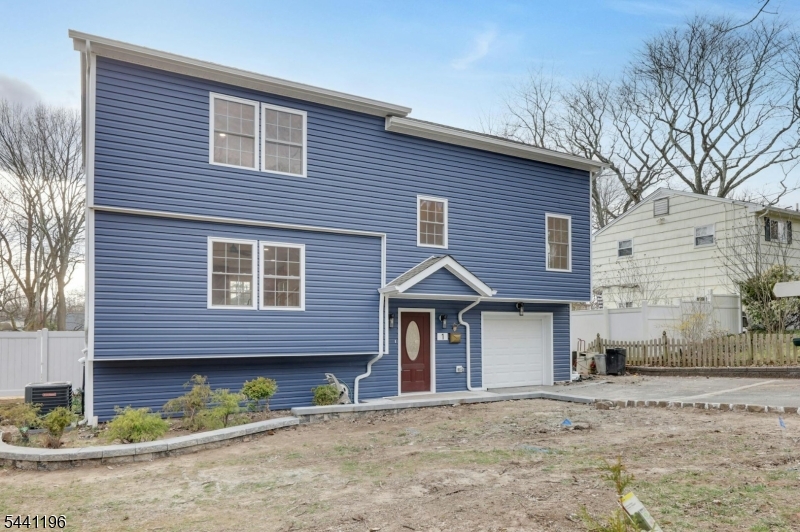 Step into Luxury Living in Hillsdale, NJ! This newly constructed custom split-unit boasts 4 bedrooms and 3 full baths, including an expansive master suite with his & hers closets and a full bathroom fit for royalty. Two of the bedrooms are ensuite, offering added privacy and convenience. Adorned with beautiful hardwood flooring throughout, this home seamlessly blends smart-home technology with unrivaled craftsmanship. Enjoy the serenity of your privately fenced-in yard from the large, beautiful deck off the dining room, flooded with natural light. With a built-in garage providing convenient access to the spacious family room and yard, multi-zone heating and central air, plus an instant hot water heater, every detail has been meticulously crafted for comfort and convenience. Welcome home to unparalleled elegance!