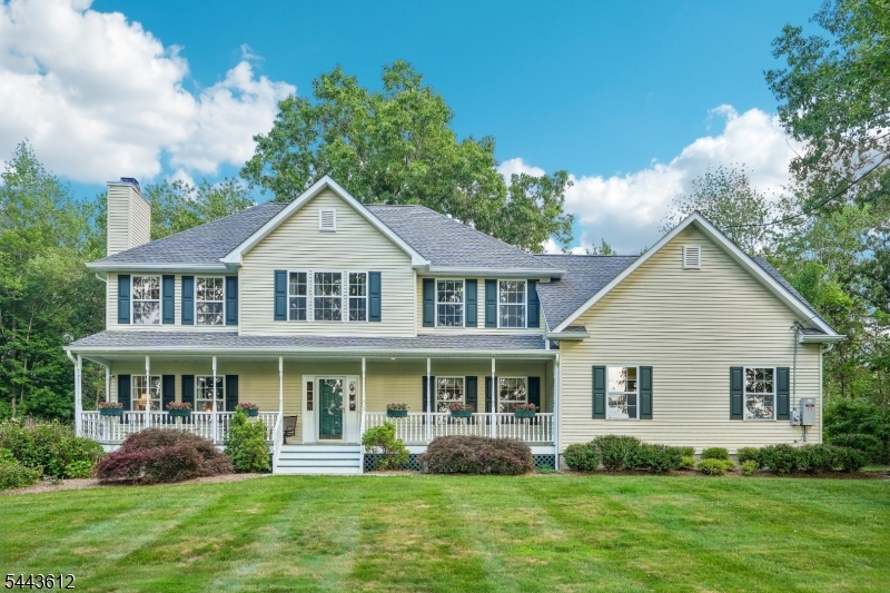 Welcome home to this beautifully maintained 4-bedroom, 2.5-bath Colonial nestled on a private wooded lot in the heart of Andover Township. A charming front porch welcomes you into a spacious interior featuring 9' ceilings, hardwood floors, and custom moldings throughout the first level. The inviting entry foyer opens to a sun-filled living room with large windows and wood burning fireplace, flowing seamlessly into a cozy den perfect for relaxation and conversation. The large dining room is ideal for entertaining and leads to the spacious eat-in kitchen featuring custom cabinetry, granite countertops, black appliances, and a separate dining area with sliding doors to the rear deck. A first-floor laundry room and powder room complete the main level. Upstairs, the spacious primary suite offers a generous closet and private en suite bath. Three additional bedrooms, a full bath, and unfinished bonus room over the garage provide exceptional flexibility. The full unfinished basement offers 8' ceilings, abundant storage, workshop and gym area, plus endless potential for future living space. Step outside to the expansive Trex deck with a SunSetter awning, perfect for outdoor dining and entertaining. The private wooded backyard is an outdoor retreat featuring a flagstone patio, custom outdoor kitchen with a built-in pizza oven, grill, side burner, fire pit, oversized 2-car garage, and ample driveway parking. Peaceful living near parks, lakes, shopping, dining & commuter routes.