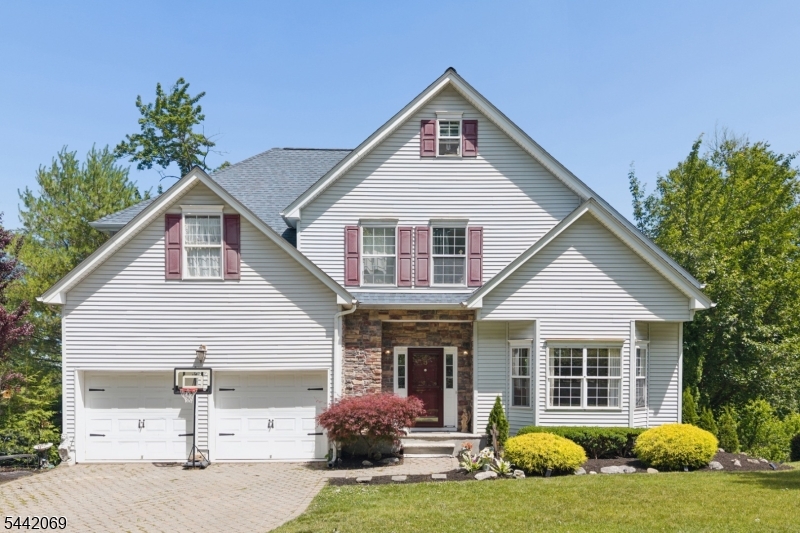 Welcome to this beautifully maintained Center Hall Colonial in desirable Panther Valley gated community! Offering spacious living, flexible bonus areas and exceptional indoor-outdoor entertaining space! The welcoming foyer opens to a formal living room and formal dining room, while the kitchen with center island flows seamlessly into the inviting family room featuring a gas fireplace. A convenient first-floor powder room, direct access to the attached two-car garage and sliding doors leading to the expansive multi-tiered deck complete the main level. Upstairs, the spacious primary suite features a walk-in closet, an additional double closet, and a private bath with a soaking tub, stall shower and dual vanity. Three additional bedrooms, a full hall bath, and the convenience of a second-floor laundry room complete the upper level. Looking for more space? The finished walk-up attic offers exceptional flex space ideal for a home office, fitness room, game room or hobby area. The finished walk-out basement provides additional recreation/entertainment space-perfect for game nights, a media room or everyday enjoyment. Step outside to the impressive multi-tiered deck-plenty of space for outdoor dining, entertaining or simply relaxing. Additional highlights include NEW roof, NEWER water heater, hardwood flooring and a paver driveway. Enjoy an exceptional lifestyle at Panther Valley with all it has to offer.