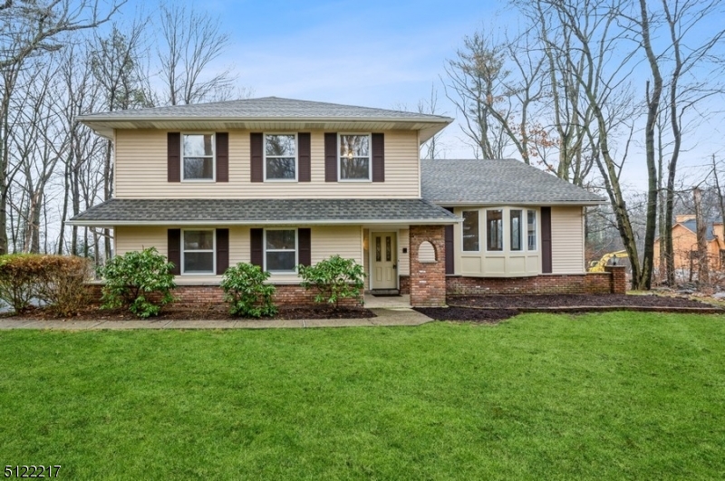 Beautifully remodeled Split Level home with 4 bedrooms 3 full bathrooms is nestled on 1.3 wooded acres within commuting distance of just 40 miles from Manhattan. Enjoy scenic lakes & green spaces offering boating, swimming, and hiking activities, close to local downtown shopping, lakeside dining, easy access to RT287 and only 8 min to RT23. This renovated home features a new roof, all new utilities and appliances, an extra-wide driveway leading to the attached two-car garage, wood-beamed ceilings, a huge three-season porch, and a deck overlooking the private wooded back yard.The freshly landscaped front yard and entry open to a spacious living room and dining area with wide-plank hardwood floors and a vaulted, wood-beamed ceiling for an open, airy feeling. Sliding glass doors from the dining room lead to the deck. The new kitchen features granite counters, stylish tile backsplash, warm wood cabinetry and a cozy breakfast nook.Off the kitchen, a large family room has a wood-burning fireplace and sliding glass doors to a large three-season room that is perfect for entertaining with walls of windows looking out on the private property. On the upper level is a large primary bedroom with an ensuite bathroom, double closets, and a walk-in closet, along with three additional bedrooms and a full hallway bathroom. A recreation room in the partially finished basement completes the package of this beautiful home with an inspiring interior and an exceptional amount of outdoor space.