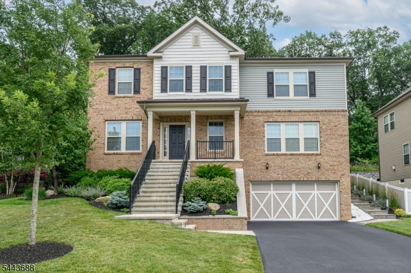 Dream Homes Exist! Beautiful 4 Bed 4 Bath Colonial w/Master Suite, 2 Car Garage & Finished Basement is sure to impress! Meticulously maintained inside & out w/modern touches all through, move in ready & waiting for you! Stately brick front welcomes you into the light & bright foyer to find gleaming hardwood flrs, a neutral palette, recessed lights & spacious room sizes throughout. French doors welcome you in to the large Living Rm. Formal Dining Rm is perfect for hosting dinner parties. The Gorgeous Eat-in Kitchen features SS appliances, granite counters, decorative tile backsplash, center island w/seating, a plethora of premium cabinetry, & walk-in pantry. Unwind in the spacious Family Rm holding a gas fireplace for chilly nights. An office space, 1/2 Bath, &  Laundry Room will complete the main lvl of this gem. Make your way upstairs to find a versatile loft area, full bath w/tub shower + 4 generous Bedrooms inc the Master Suite. Master Bedroom boasts a walk-in closet & its own private ensuite bath w/dual sinks, tranquil soaking tub & stall shower. Finished Basement adds to the package offering a large Rec Rm, versatile Bonus Rm, & 1/2 Bath. Relax outdoors on the paver patio & enjoy summer w/the built in BBQ & outdoor Kitchen, backing to woods & fenced in for privacy. Central Air/Forced Heat/2 Car Garage, double wide drive, the list goes on! Close to shopping, dining, parks, & schools + public transportation & major rds for easy commuting. Don't wait, come & see TODAY!