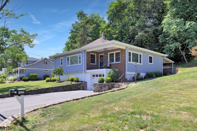 Beautifully renovated 3-bedroom home offering the perfect blend of modern updates and everyday convenience. The open-concept floor plan creates a bright and inviting living space, seamlessly connecting the living room, dining area, and stunning new kitchen ideal for both entertaining and comfortable daily living. Nestled on a picturesque lot, this move-in-ready home offers a peaceful setting while remaining within walking distance of the NYC train, making commuting a breeze. Features include stylish updates throughout, spacious bedrooms, abundant natural light, and a versatile layout designed for today's lifestyle. Enjoy the best of both worlds modern living in a desirable location close to transportation, shopping, dining, parks, and local amenities.