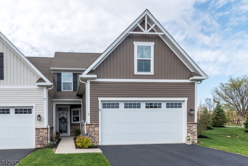 Welcome to The Villages at Hawk Pointe Community an active 55+ community. Explore this exquisite, four-year-new end-unit townhouse, designed to maximize natural light and featuring charming front and rear porches. The main level offers effortless living with a gourmet kitchen, complete with granite countertops, ample cabinetry, and a breakfast bar. It seamlessly flows into an open-concept dining and living area, perfect for entertaining.  Also on this floor is a spacious primary suite featuring a private en-suite bath, ideal for single-floor convenience, alongside a powder room and dedicated laundry area. Upstairs, you'll find a generous second bedroom, a full bathroom, and a flexible loft space that can effortlessly transform into a home office, guest suite, or a cozy lounge. Step outside to discover a delightful covered porch, providing a serene spot for morning coffee or evening relaxation, extending your living space outdoors. Take advantage of the optional community amenities, featuring the Hawk Pointe golf clubhouse, pool, tennis courts, fitness room and activities within walking distance! A 30-year tax abatement 'PILOT' program is in place that transfers to new owners, with a new calculation done at closing. Great location, convenient to Routes 31 and 78, medical providers, a grocery store with home delivery and drive-up pharmacy, and restaurants.