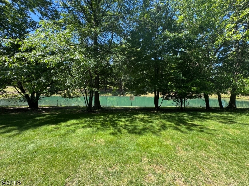 A beautifully updated second-floor condo offering comfort, convenience, and scenic views. This spacious 2-bedroom, 2-full-bath unit has been freshly painted and features brand-new laminate flooring and recessed lighting throughout, creating a bright, modern, and inviting living space. Enjoy your morning coffee or unwind after a long day while taking in the peaceful pond views from your balcony that provide a picturesque backdrop year-round. The open layout offers comfortable living and dining areas, perfect for both everyday living and entertaining. The primary suite features a walk-in closet and a private full bathroom with a stall shower, offering both comfort and convenience. A generously sized second bedroom and an additional full bathroom provide ample space for guests or a home office setup. Adding to the home's functionality is a spacious utility room equipped with a full-size washer and dryer, providing ample storage space and everyday convenience. Ideally located just minutes from Jersey Avenue Train Station, this home is perfect for commuters. Residents will also appreciate easy access to Route 1, major highways, and an abundance of shopping, dining, and everyday conveniences nearby. Don't miss this opportunity to rent a move-in-ready home in a desirable North Brunswick location, offering beautiful pond views, modern updates, and an unbeatable location. NO PETS NO SMOKING INSIDE THE UNIT NO COMMERCIAL USE