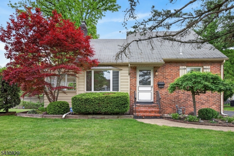 This charming Cape Cod will capture your heart from the moment you arrive. Set in a beautiful and peaceful neighborhood, the home welcomes visitors with a gorgeous front lawn framed by an elegant wooden fence, creating exceptional curb appeal and a warm sense of arrival. Step inside and discover a generously sized living room that flows seamlessly into the screened sunroom - the perfect place to enjoy a morning coffee or unwind while overlooking the serene surroundings. The private backyard, bordered by mature hedges, offers a tranquil outdoor retreat with a wonderful sense of privacy. Two bedrooms and a full bathroom on the first floor allow for convenient everyday living. Upstairs, an oversized bedroom suite with its own full bath provides flexibility and comfort. With both interior access through the kitchen and a separate exterior entrance, this space is ideal for extended guest stays, a private retreat, or a variety of lifestyle needs. Additional features include an unfinished basement with a fireplace offering exciting potential, as well as a detached one-car garage. A wonderful opportunity to enjoy charm, privacy, and flexibility in a truly inviting setting.