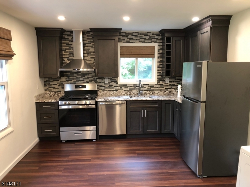 Gorgeous must see fully renovated one bedroom apartment.  Private entrance leads into a large foyer, fully renovated eat in kitchen with granite countertops, new cabinetry and stainless-steel appliances, a spacious bedroom offering a large walk-in closet, stackable washer and dryer in laundry room and air conditioning throughout.  Excellent location near the hospital and set back off main road with 3 dedicated off-street parking spots.  This stunning apartment is vacant and has immediate availability.