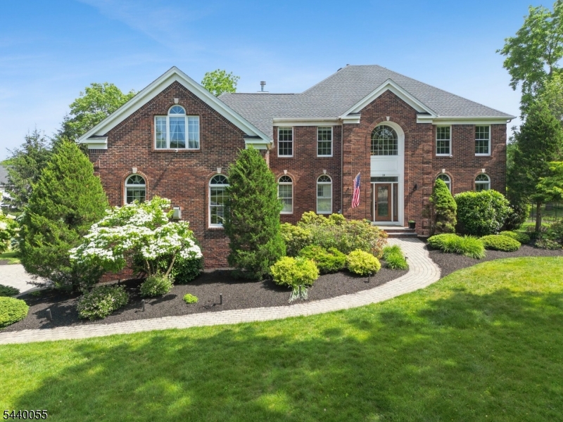 Welcome to this stunning, custom-built 4BR, 3.5BA Colonial in one of Randolph's most prestigious neighborhoods, where architectural elegance meets everyday luxury living. From the moment you step into the dramatic 2-story foyer, you'll appreciate the thoughtful design & superior craftsmanship throughout. The main level is an entertainer's dream, anchored by a breathtaking great room w/ soaring coffered ceilings, dramatic arched windows, gleaming HW floors, wet bar & a striking stacked-stone FP. A spacious FR w/ built-ins & 2nd FP offers warm, refined gathering space, while the adjacent play room/dining room adds versatile living options. The kitchen & sun-drenched breakfast nook w/ bay windows create a light-filled heart of the home- appointed w/ center island, granite countertops, SS appliances & custom cabinetry. Direct access to the 24' x 19' trex deck makes indoor-outdoor entertaining effortless. The primary suite is a true retreat, boasting dual WICs & a spa inspired BA featuring a freestanding soaking tub, double vanity w/ quartz countertops, marble tiled custom glass shower, backlit mirrors & designer marble tile floor. 3 additional BRs & an oversized au pair/in-law suite w/ private full BA offer exceptional flexibility. The LL features a secluded room for fitness, expansive utility & storage space, direct entry to 3-car garage & walkout access to the beautifully landscaped rear grounds.  An extraordinary home offering elegance, space, and unmatched versatility.