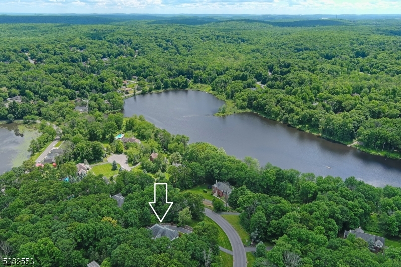 First time offered by original owner who made very tasteful and smart upgrades during build including several arched transom windows, a 2nd stair case to upper level, a bonus room off kitchen (plus Fam Room, Living Room, and home office also on the 1st floor), a gas fireplace in the Primary Suite, and HUGE SIDE PORCH.  Seller also states "room for pool in right rear yard".  Don't miss walk-in closets in BR 3 and 4 with Jack-N-Jill bath in between, En Suite Bath in BR 2, and exceptional views from most windows.