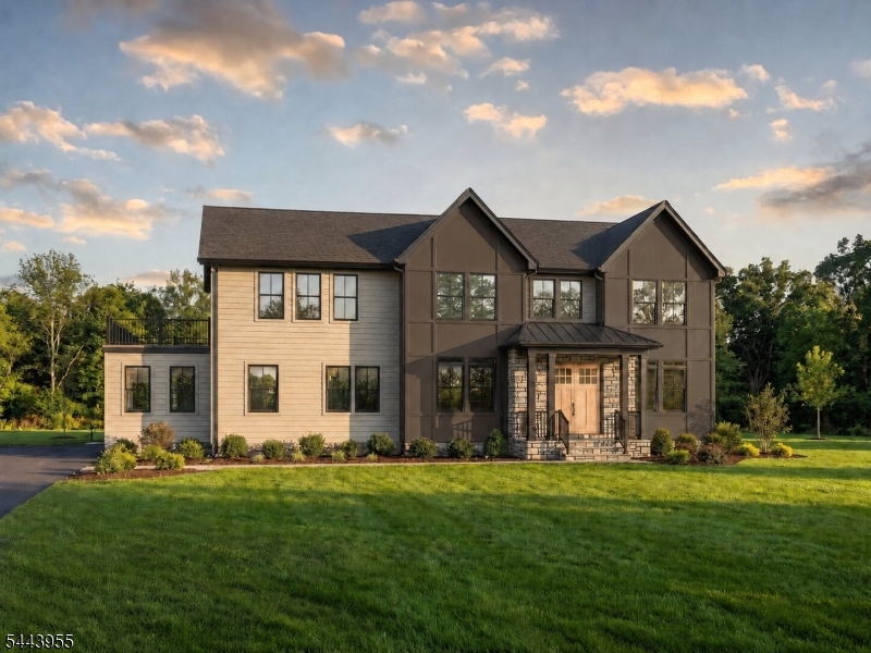 An exceptional opportunity to own a custom-designed residence by Prawdzik Properties, offering approximately 5,800 sq ft of meticulously crafted living space on over an acre at the end of a quiet dead-end street in Randolph. Designed with timeless architecture and elevated finishes, this 6-bedroom, 5.5-bath home features a first-floor bedroom suite, private office, mudroom, finished lower level, and an oversized 3-car garage. Soaring 10' ceilings, white oak hardwood flooring, custom millwork, and a statement fireplace create a refined yet inviting atmosphere. The chef's kitchen is appointed with premium Monogram appliances, quartz countertops, a walk-in pantry, and an expansive center island designed for effortless entertaining. The luxurious primary suite offers dual walk-in closets, heated bathroom floors, a soaking tub, and a private retreat for everyday comfort. A spectacular 600 sq ft walk-out second-floor balcony extends the living experience outdoors, providing an exceptional space to relax, entertain, or enjoy the surrounding property. Built with Andersen windows, James Hardie siding, multi-zone HVAC, generator-ready and EV-ready infrastructure, every detail reflects superior craftsmanship and thoughtful design. The finished lower level provides exceptional flexibility for recreation, fitness, media, or entertaining. Buyers still have the rare opportunity to personalize select finishes before the anticipated December 2026 completion.
