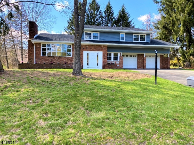Complete Renovation-New Roof,siding,windows,doors,furnace,H/W tank,septic,Central A/C,Kitchen w/Granite,2.5 New Baths,flooring,& more. Great neighborhood set on beautiful 1/2 acre corner lot. Oversized Split with steel beam construction.  Eat-In Kitchen w/SS appliances & Granite counters w/sliders to yard, LR w/stone fireplace w/new insert & liner, Formal DR w/sliders to patio, New hardwood flooring, 3 generous size bedrooms on 2nd level with office.  Master offers dressing area & full bath, New nat'l gas hookup, public water, new furnace, hot water tank, central a/c, roof, windows, siding, doors, 3 car garage w/2 garages in front and one attached in back. Ideal for workshop or additional storage. Plus there's a full basement just waiting to be finished.  Plenty of storage in this home also.