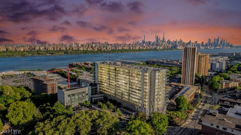 Experience luxury living at One Park in Cliffside Park, a 5-star luxury condominium offering breathtaking Hudson River and NYC skyline views. This stunning east-facing 3-bedroom residence features floor-to-ceiling windows, a modern Italian-inspired kitchen, spa-like bathrooms, smart-home wiring, in-unit laundry, and abundant storage throughout. Residents enjoy over 25,000 square feet of world-class amenities, including an indoor pool, state-of-the-art fitness center, sauna, yoga studio, golf simulator, media and billiards rooms, guest suites, outdoor entertainment areas, and more. Conveniently located near shopping, dining, major highways, and NYC transportation, this exceptional home delivers the ultimate blend of luxury, comfort, and convenience in one of the Gold Coast's premier addresses.