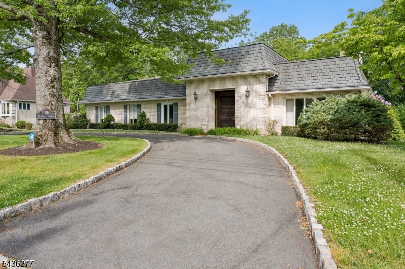 You are invited. If you are looking for an "Italian Inspired Villa" this one owner custom built ranch is for you. Situated on a quiet cul-de-sac close to the Watchung Reservation this impressive brick ranch is positioned to take full advantage of all Mountainside has to offer. Tall trees and mature shrubbery artfully frame the exterior. The property offers a tranquil setting while shopping, recreation, school and NYC Summit commuter trains are only a few minutes away. Inside elegant spaces are arranged in an effortless flow as sunlight makes its way in through large windows. On the first floor 3 bedrooms, 2 full baths, powder room, kitchen, dining room, living room, family room with fireplace. Lower level offers large rec room with wet bar, office, powder room and much much more. A Must See!