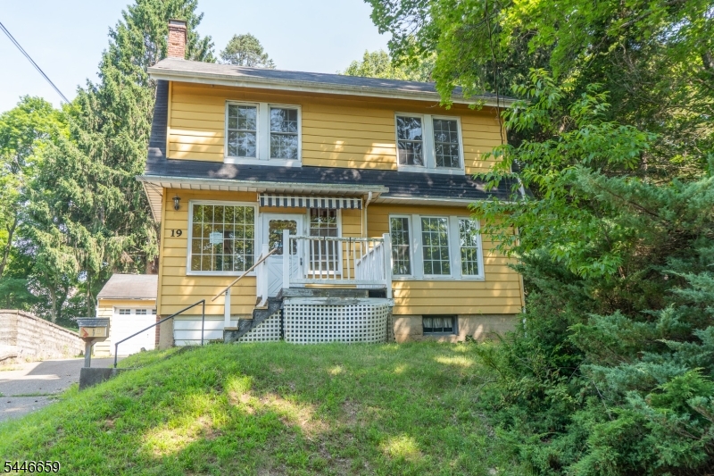 Rare opportunity to own a charming 3-bedroom, 1.5-bath home tucked away at the end of a quiet dead-end street with direct access to the Columbia Trail. Enjoy hiking, biking, running, and the beauty of nature just steps from your backyard, along with seasonal views of the Raritan River.This home features hardwood floors, a spacious living room with a fireplace, an eat-in kitchen, a formal dining room, and three generously sized bedrooms. The full walk-up attic, complete with a wide staircase and four windows, offers outstanding potential for future expansion. The unfinished basement is ready to be transformed to suit your needs, and the detached garage provides additional storage and convenience.Relax on the porch or entertain on the rear deck overlooking the private backyard. The home offers a beautiful floor plan with generous living space and is ready for your personal touches to make it truly your own.Conveniently located close to schools, shopping, dining, and major commuting routes, including I-78 Exit 20 less than five miles away, this property combines a peaceful setting with everyday convenience. A wonderful opportunity to create your dream home while enjoying direct access to one of the area's most desirable recreational trails.
