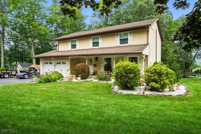 Welcome Home! Charming Colonial on .56 acres of beautifully landscaped level, corner lot in the Coveted Camelot Estate Section of Budd Lake. Pride of ownership shines! Immaculate & carefully thought through & cared for by the same owners for 30 years. Lots of Generous Room Sizes to Spread Out & Make Your Own! This 2,100 sq ft Home has a Comfortable, Spacious Floor Plan. Many Appealing Features Throughout. Granite Counters, tile backsplash, low maintenance laminate flooring, double insulated vinyl windows & newer mechanicals! Just to name a few! First floor offers your classic & highly functional layout. Formal living room & dining. The eat-in kitchen overlooks the backyard & a cozy family room. Powder room & coat closet off foyer. Upstairs, 5 generous sized bdrms & 2 full baths including the primary suite.Tons of bonus space in the full bsmt! Rec room area, laundry, workshop & plenty of storage! 2 Car Garage ! Flat backyard with paver patio - Perfect for Entertaining & Relaxation! Great home, lot & condition with great school system only minutes to Rts. 80, 46, 206, 10, trains, shopping & Lake Life. Highest and Best Deadline Wednesday, 8/20 by 12 pm