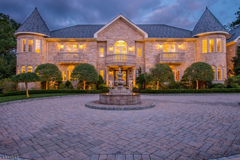 Located in Rio Vista, one of Mahwahs most prestigious enclave & its best kept secret.The approx. 21,000 SF home has breaktaking views of Ramapo mountains & is the only property w/ gates, fully enclosed w/ metal fence. The entryway is graced w/ 25 ft soaring ceilings, pink coral marble flooring, granite stone & natural lighting throughout. The home boasts 30 Rms, 7 Bdrms each w/ its own suite, balcony, private bths, & reaction area, 8 full bths, & 3 kit. The  entryway sweeping staircase draws you into a voluminous layout made for entertaining. The fam rm opens to a tranquil backyard & is accompanied by a chef?s kit w/viking appliances & formal din rm. A full bar, ample party space, music cafe, 5 person elevator and five-car garage complete this home. Additl feat: 17 zone radiant heat, steel frame