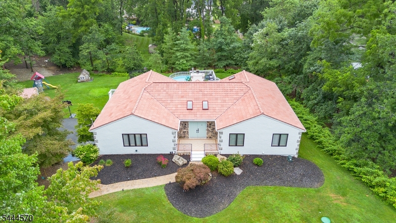 Your dream home has arrived! Set on a spectacular lot with an expansive deck, above-ground pool, and plenty of space to relax or entertain, this sprawling custom ranch offers the perfect blend of comfortable living, flexible space, and everyday convenience. Its convenient location provides easy access to shopping, dining, major highways, NYC transportation, and Kinnelon's outstanding school system. Live and entertain with ease as the home offers: a welcoming foyer, spacious living room, inviting family room with wood-burning fireplace, formal dining room, large eat-in kitchen with granite countertops, pantry, and slider to the full-length deck, updated bathrooms including a brand-new primary bath, generous bedrooms, and abundant storage. The fully finished walkout lower level provides exceptional versatility with its own kitchenette, dining area, living room, potential bedroom, and full bath, creating an ideal private suite for extended living, guests, or a variety of additional uses. A large storage shed and thoughtful updates throughout complete this exceptional opportunity. Don't miss this opportunity. Schedule your private tour today.