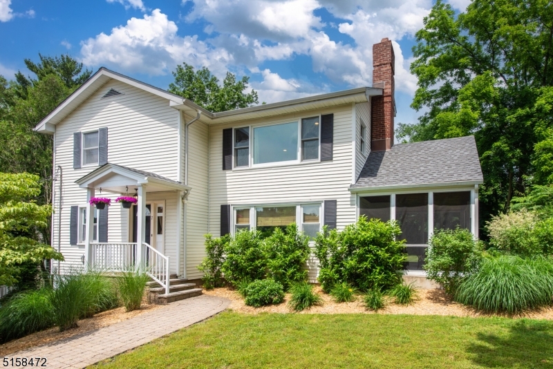 Stunning 4 bedroom 3 bath colonial in the heart of Caldwell. Hardwood floors throughout and lots of windows. Spacious living room with wood-burning fireplace. The kitchen offers granite countertops, stainless steel appliances and a breakfast bar and is open to the dining room. A bedroom (currently used as an office) and a full bathroom complete the main floor. Upstairs is a master with a walk-in closet and en-suite with a double vanity and stall shower. Two additional bedrooms, a full bathroom as well as the laundry area complete the floorplan. The basement can be used as a family room or playroom and has a large separate storage area, the garage entrance and utility room. The exterior boasts a flat backyard, a large paver patio as well as a screened-in side porch. Close to downtown shopping and dining and a NYC bus stop down the street, this house is a must see.