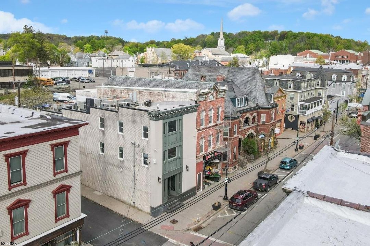 Rare mixed-use investment opportunity in the heart of Newton?s thriving business district. This fully upgraded 6,300+ sq ft building offers a clear path to value with commercial use on the first floor and residential conversion potential on the second and third floors. With over $1M in capital improvements completed, the heavy lifting is done allowing investors, developers, or owner users to focus on repositioning and income potential. The third floor already includes a full kitchen, full bath, and large flex space, ideal for a one-bedroom unit or owner?s suite. The second floor features an open layout, two bathrooms, utility/storage areas, and a separate rear entrance, supporting potential for multiple residential units. The first floor remains commercial and includes a reception area, secure vestibule with two-door man trap, half bath, and side loading access, well suited for medical, professional office, retail, or restaurant use. Currently outfitted as a secure data center with cooling, fiber/data infrastructure, fire suppression, and advanced security. The basement provides additional storage and utility space. Walkable downtown location with direct access to municipal parking plus shops and restaurants. Close proximity to Starbucks, Chipotle, Five Guys, grocery, and major retailers including Walmart.