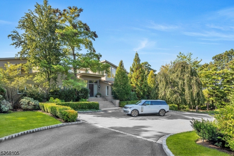 Tucked away in Livingston's Chestnut Hill neighborhood, this sprawling 15,000-square-foot residence is a testament to refined luxury and comfort. As you step into the grand entrance, prepare to be surprised by what awaits within where soaring ceilings, meticulous attention to design and exceptional craftsmanship all converge to tell a story of sophistication and grandeur. The heart of this home is a culinary enthusiast's dream kitchen, effortlessly flowing into dining and leisure areas designed for both lavish and cozy gatherings. The piece de resistance is the serene first-floor primary suite which offers complete privacy with an abundance of natural light, a sumptuous bath with a focal and decadent soaking tub, a boutique-inspired dressing room of unparalleled elegance and a spacious sitting room/office, all designed to pamper and indulge the senses. Beyond the personal quarters, the home boasts a voluminous living room, fireside library, three inspiring office spaces, 4 fireplaces, 5-car garage and a lower-level entertainer's dream with game room, recreation room, home theater, exercise room, indoor sports court, second full kitchen and cabana with sauna. And while all of these indoor amenities make this a home where friends will always gather and every exterior will pale in comparison, an expansive outdoor deck and free-form pool are available for those warm summer days. This bespoke residence is most certainly where the old adage "There's No Place Like Home" originated.